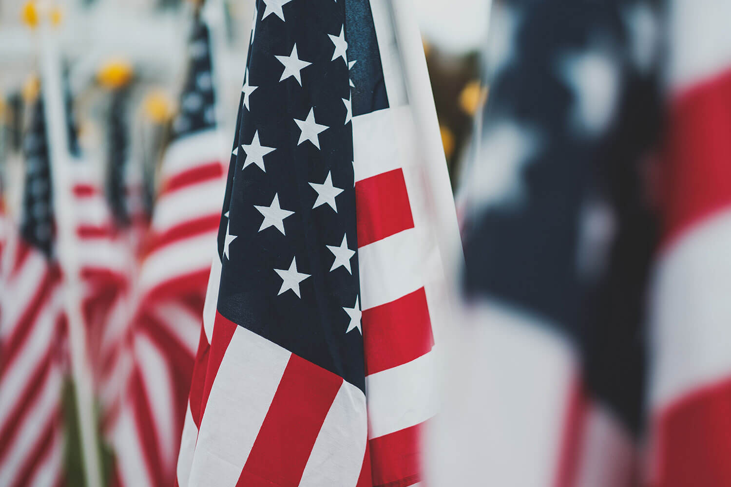 Close up of American Flag surrounded by other American flags out of focus