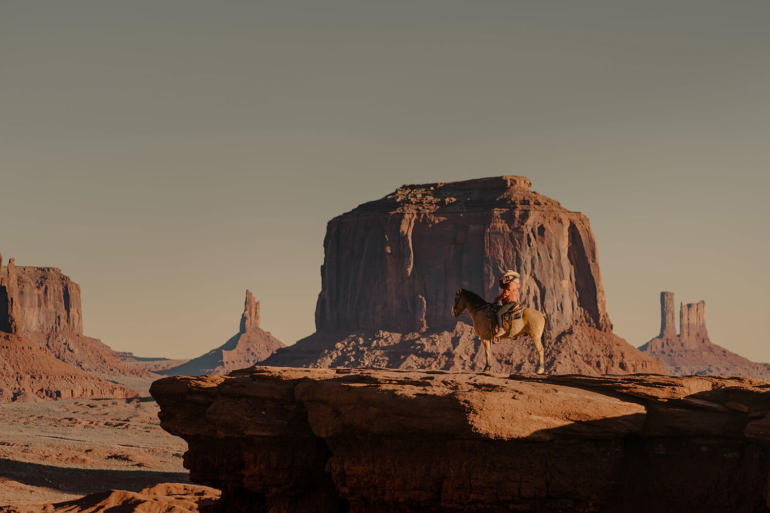 American cowboy on horseback in the Arizona rocky desert