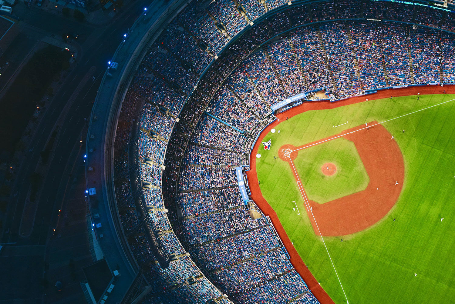 A top down aerial photo of a full baseball stadium